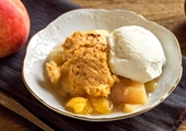 Pair peach cobbler with homemade ice cream for the perfect summer dessert