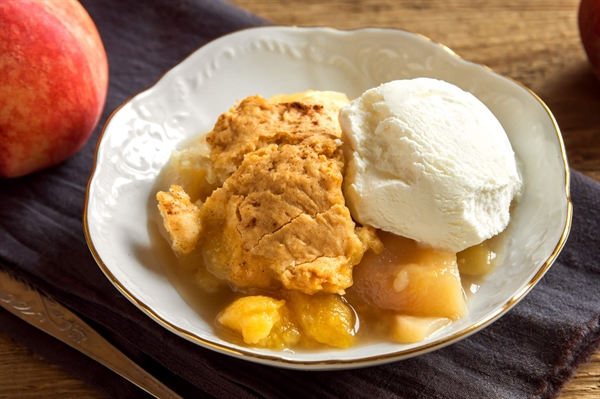 Pair peach cobbler with homemade ice cream for the perfect summer dessert