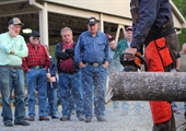 Logging experts demonstrate chainsaw safety at Farm Bureau event