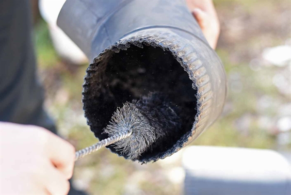 Schedule annual chimney sweep and inspection ahead of heating season