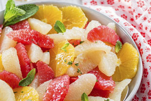 Citrus fruit salad with honey mint lime syrup